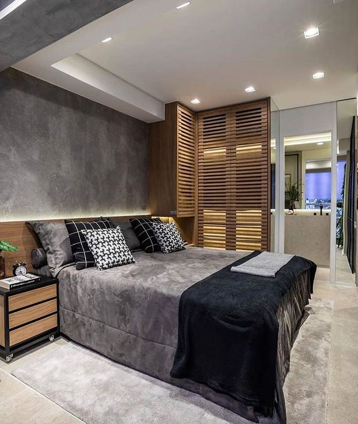 Quarto com parede de cimento queimado e ...